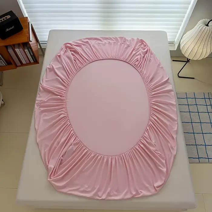 Drap-housse délavé de couleur unie avec bandes élastiques