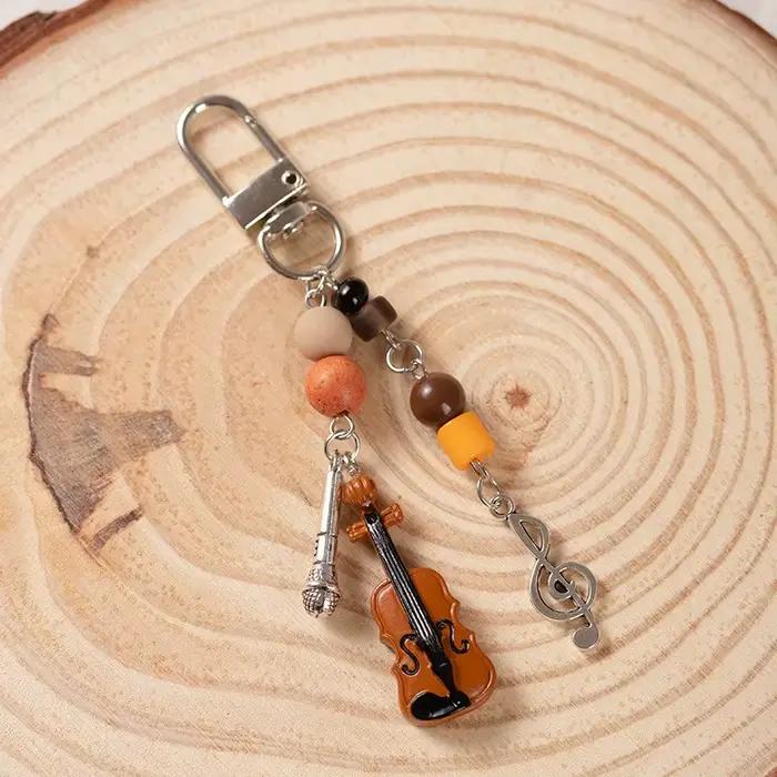 Violon Microphone perle musique porte-clés chaîne de téléphone portable Niche rétro sac pendentif Blackpack lanière accessoire porte-clés cadeaux