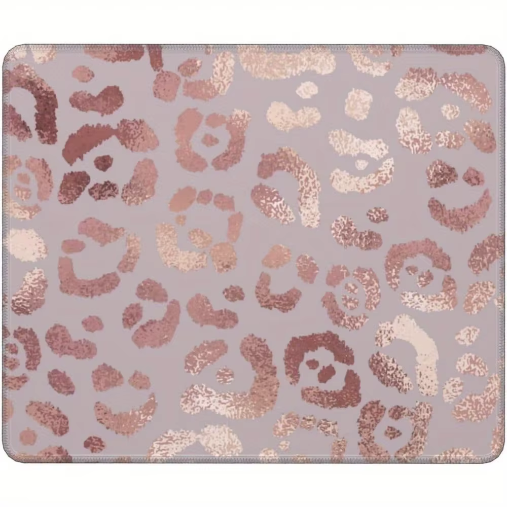 Le tapis de souris rose scintillant imprimé léopard est composé de caoutchouc lavable et antidérapan