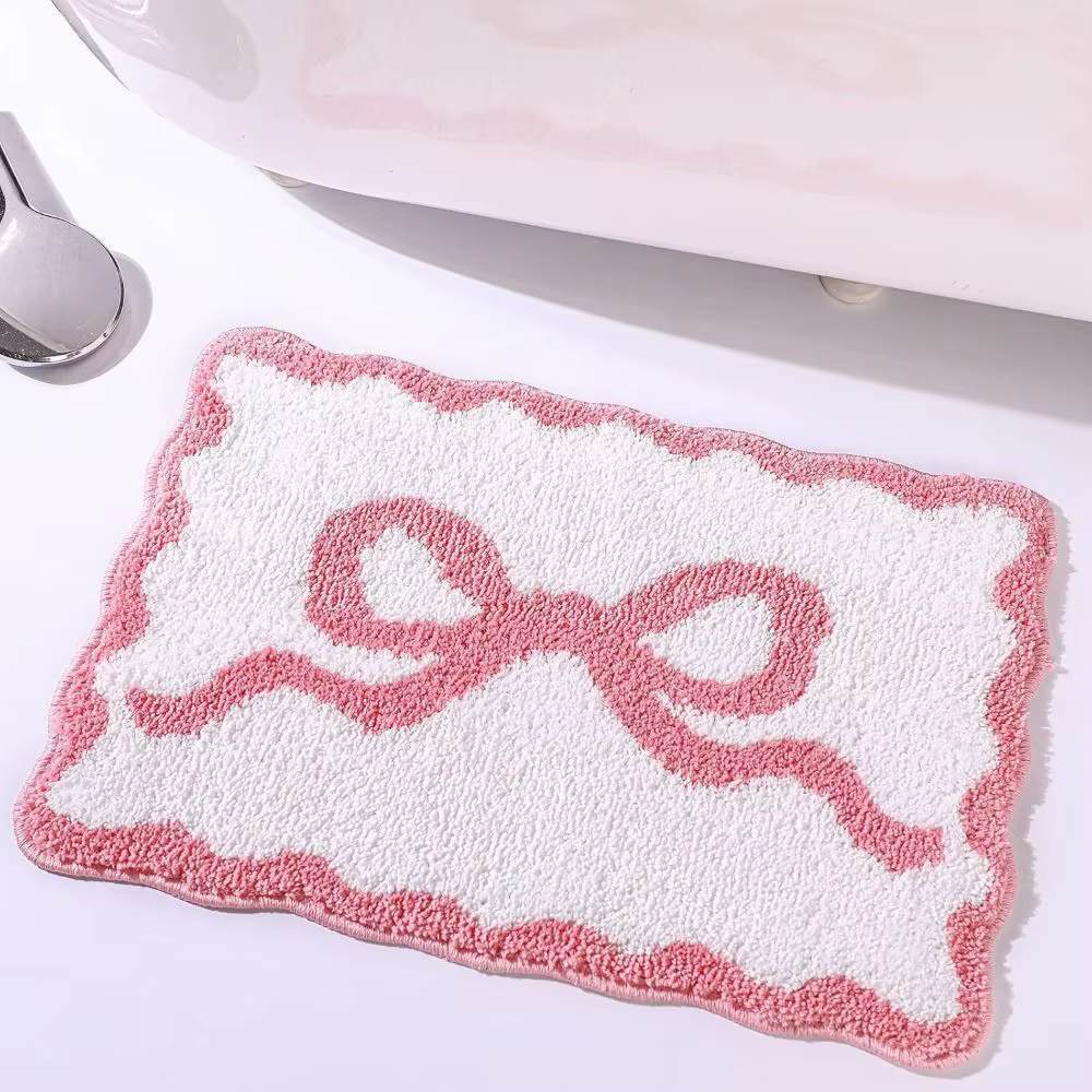 Tapis de salle de bain avec nœud rose et bleu